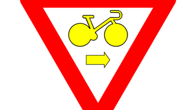 Nieuw verkeersbord B22 aan kruispunt Herenthoutseweg-Veldhoven : fietsers mogen door rood licht